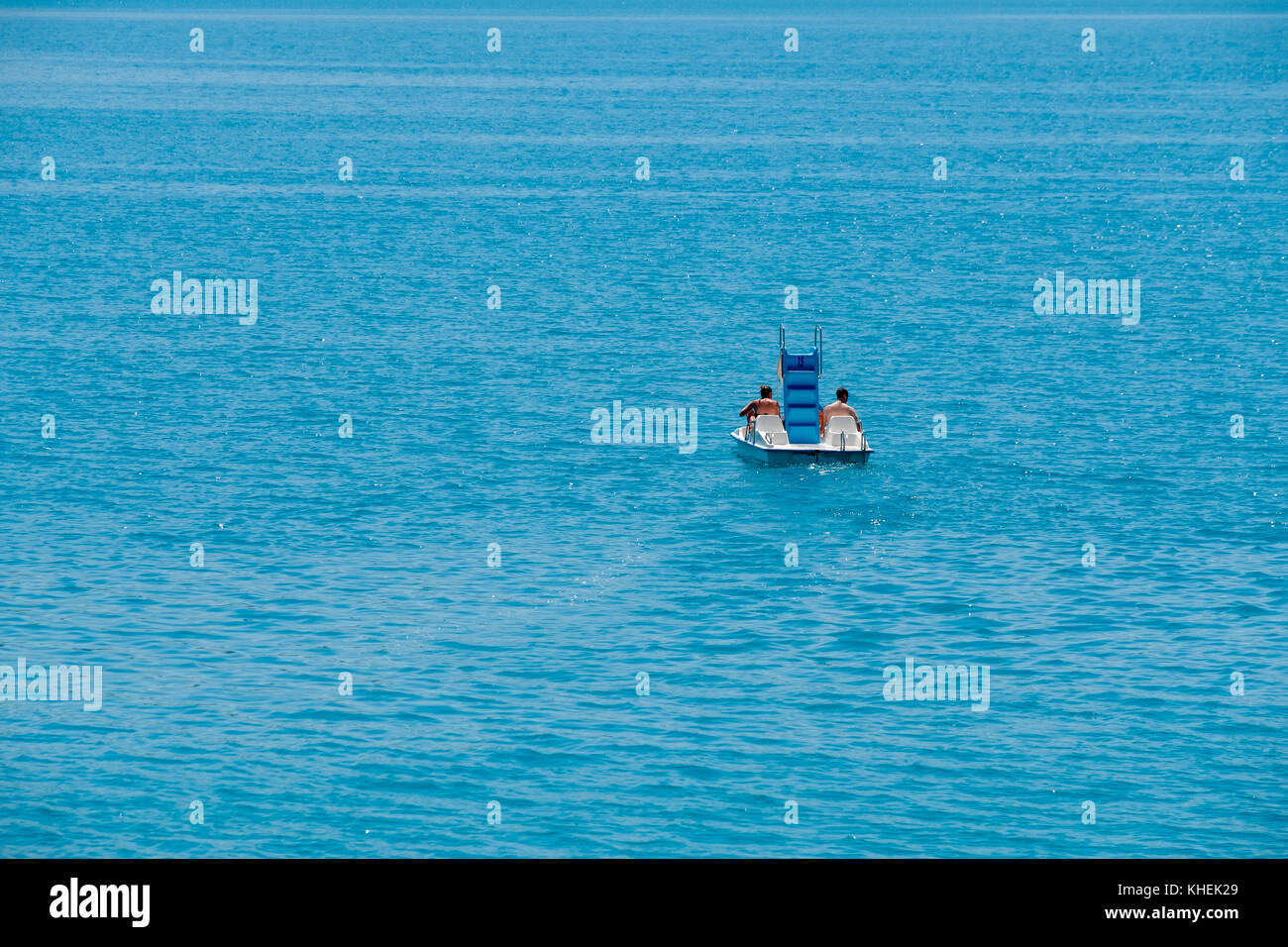 Couple riding pedal boat Stock Photo Alamy