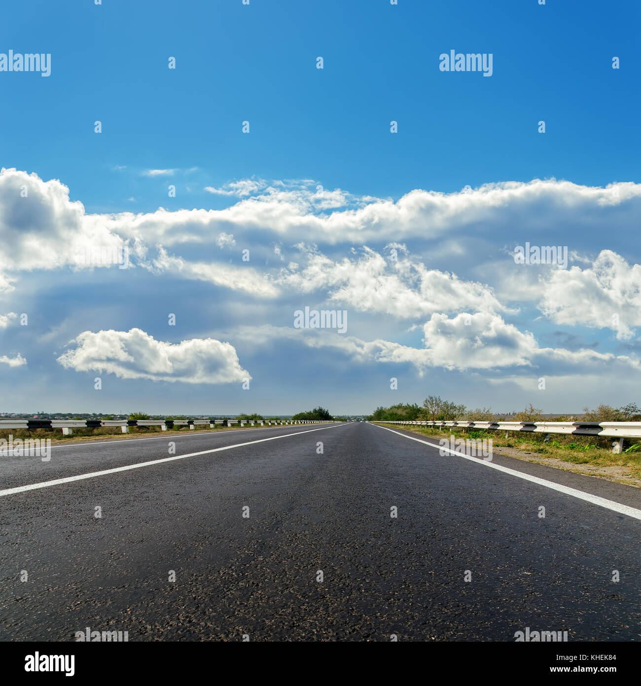 asphalt road to cloudy horizon Stock Photo - Alamy