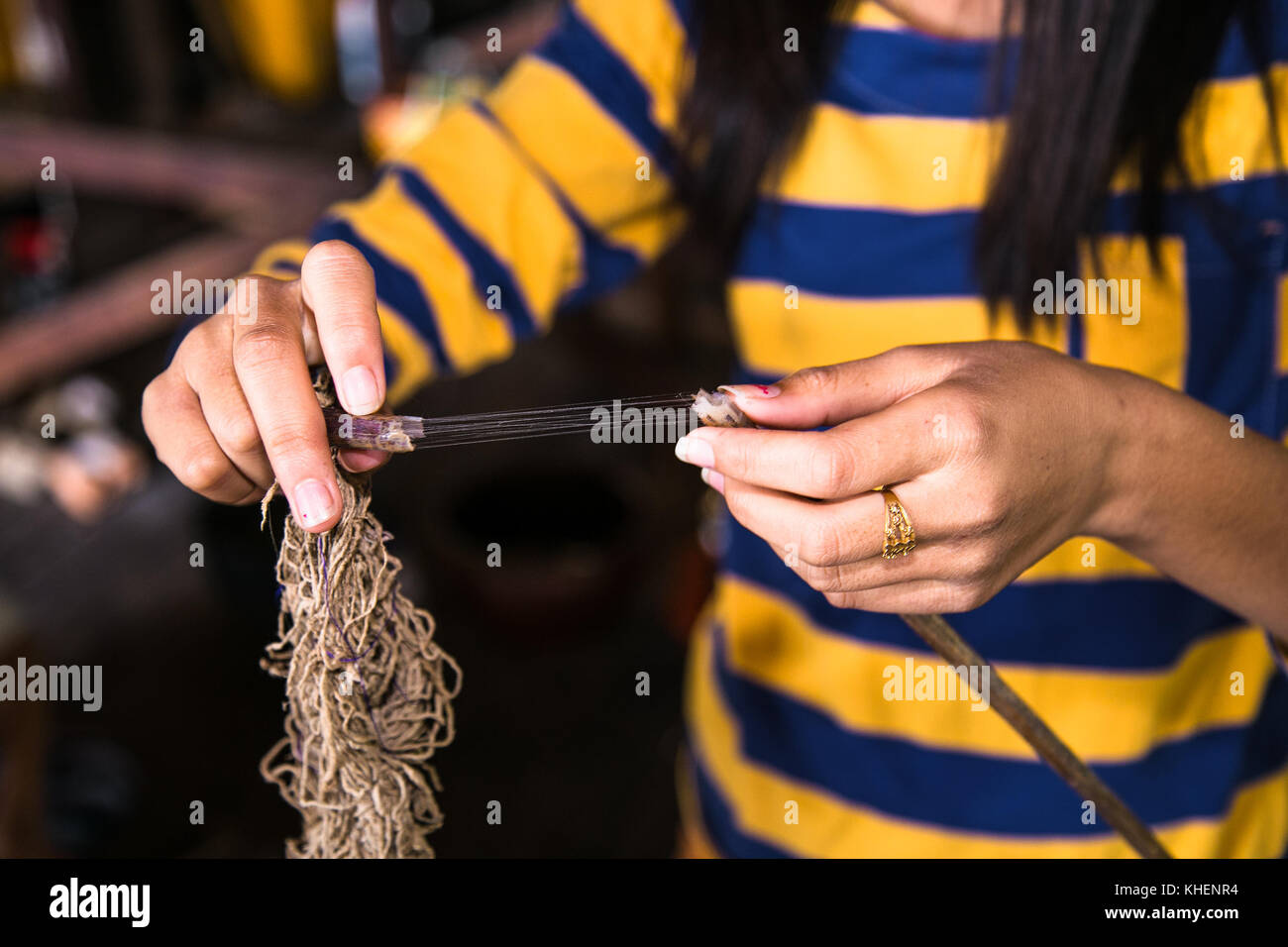 Woman making thread from lotus flower at Inle Lake, Myanmar.(Burma) Stock Photo
