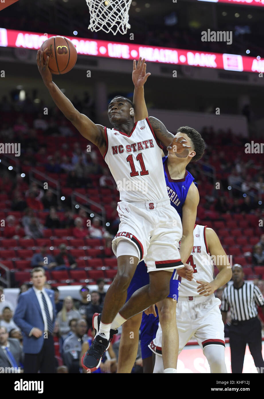Raleigh, North Carolina, USA. 16th Nov, 2017. MARKELL JOHNSON (11) of North Carolina State scores with a layup against RUBEN ARROYO, right, of Presbyterian. The North Carolina State University Wolfpack hosted the Presbyterian Blue Hose at the PNC Arena in Raleigh, N.C. Credit: Fabian Radulescu/ZUMA Wire/Alamy Live News Stock Photo