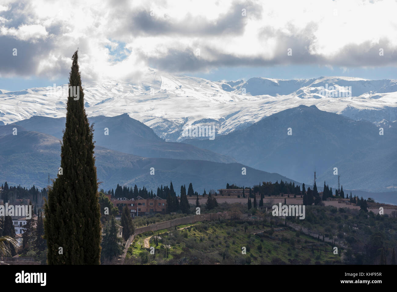 View from the Torre de la Vela, Alcazaba, Alhambra, Granada, Andalusia, Spain, with the snows of the Sierra Nevada in the distance Stock Photo