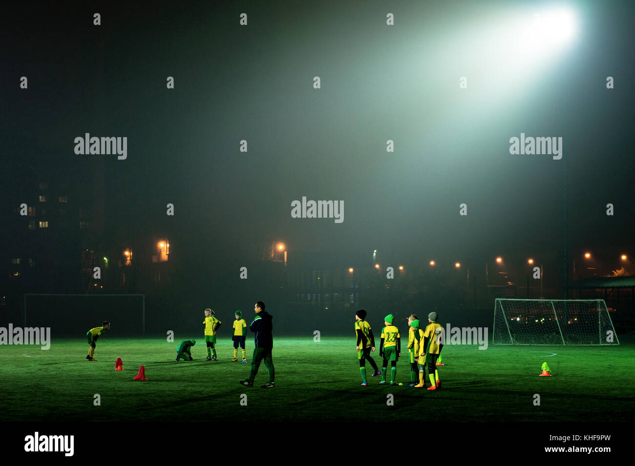 football team trains in the stadium at night Stock Photo Alamy