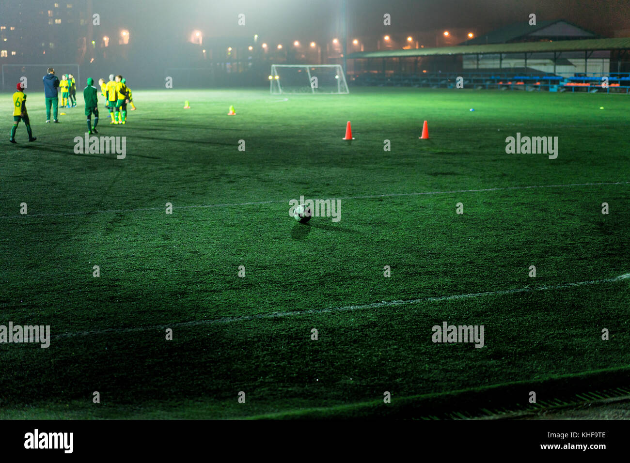 football team trains in the stadium at night Stock Photo Alamy