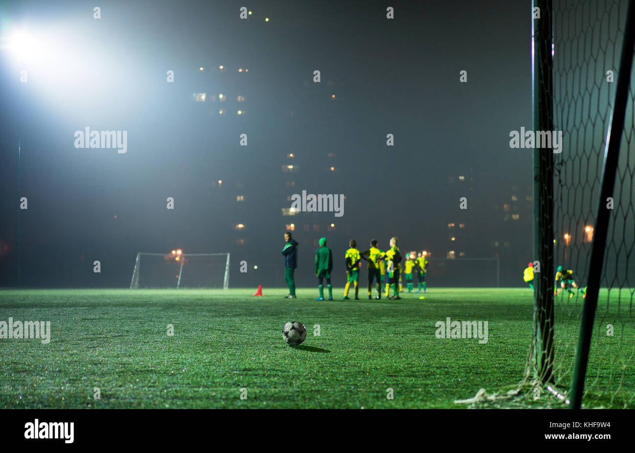football team trains in the stadium at night Stock Photo Alamy