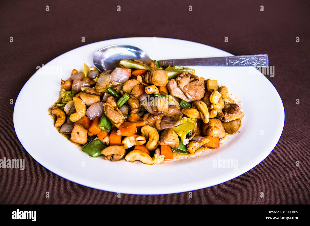 Plates of Asian food - chicken with vegetables, Myanmar. (Burama) Stock Photo
