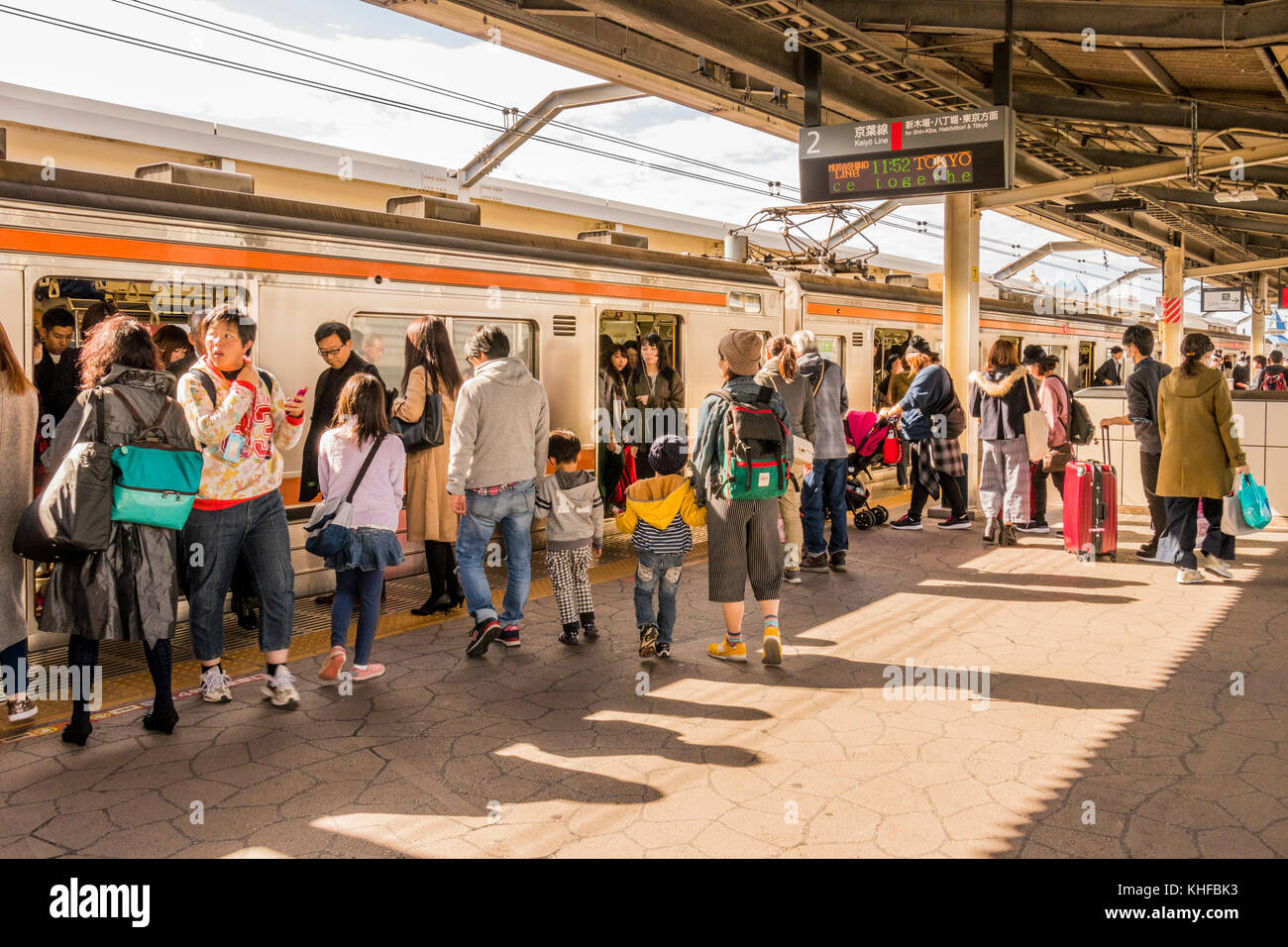 Passengers at JR Maihama railway station Tokyo bay Japan Stock Photo