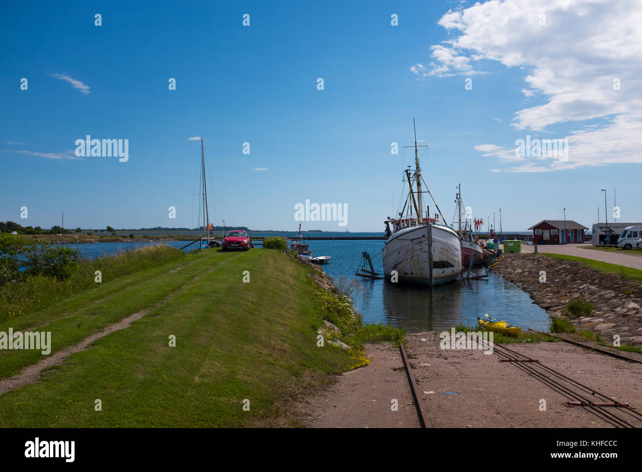 Calm smalltown fishing harbor in southern Sweden Stock Photo