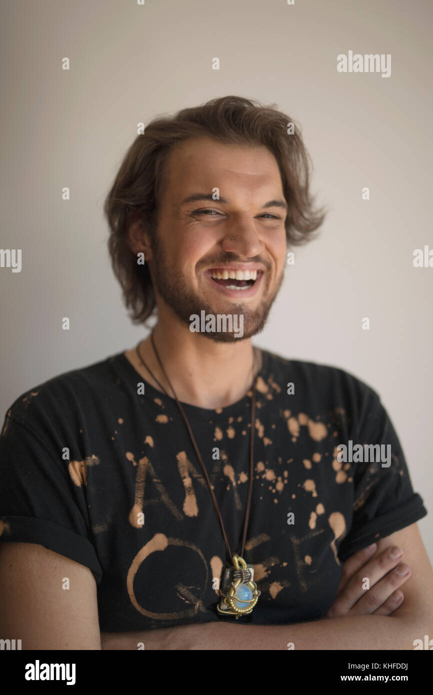 Portrait of a laughing young man Stock Photo - Alamy