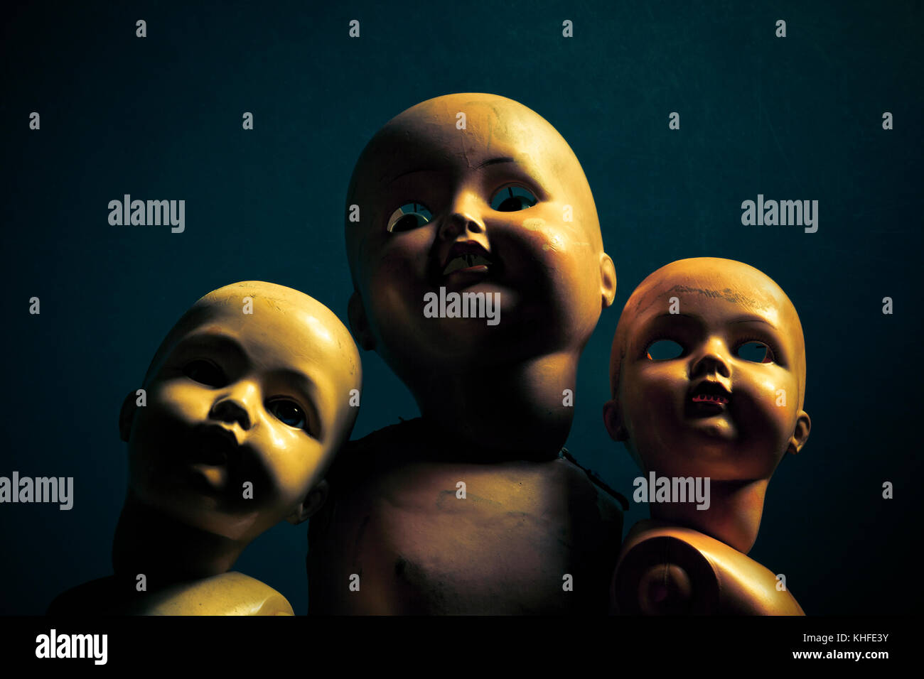 Three creepy dolls in the dark Stock Photo Alamy