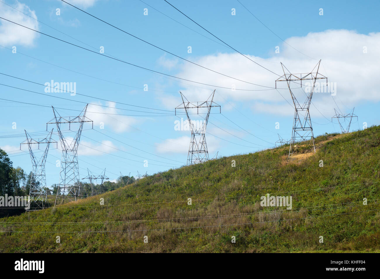 Electrical transmission line towers covering hillside near a TVA power