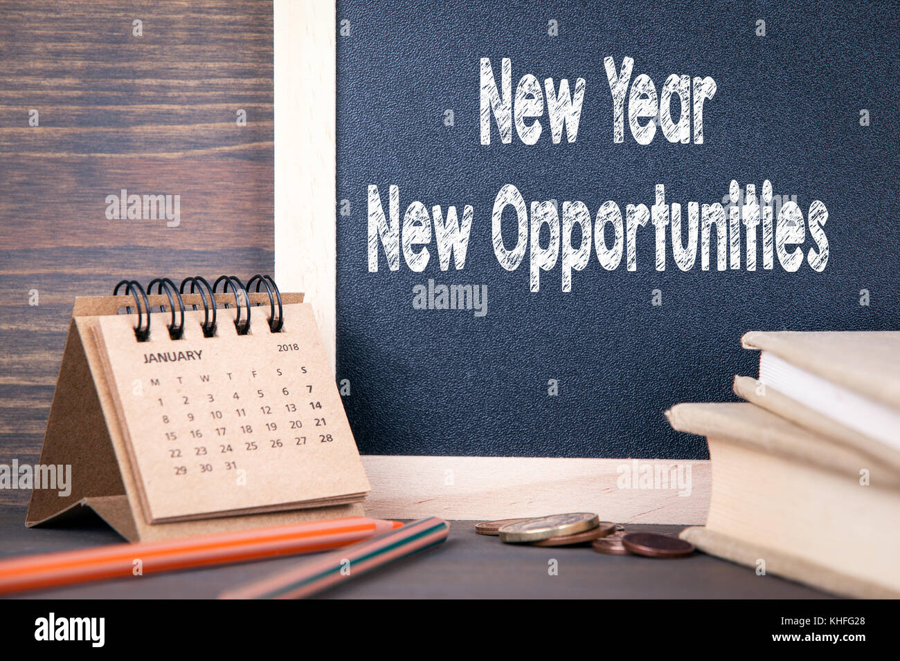 New Year New Opportunity New Year New Opportunities. Paper Calendar And Chalkboard On A Wooden Table  Stock Photo - Alamy
