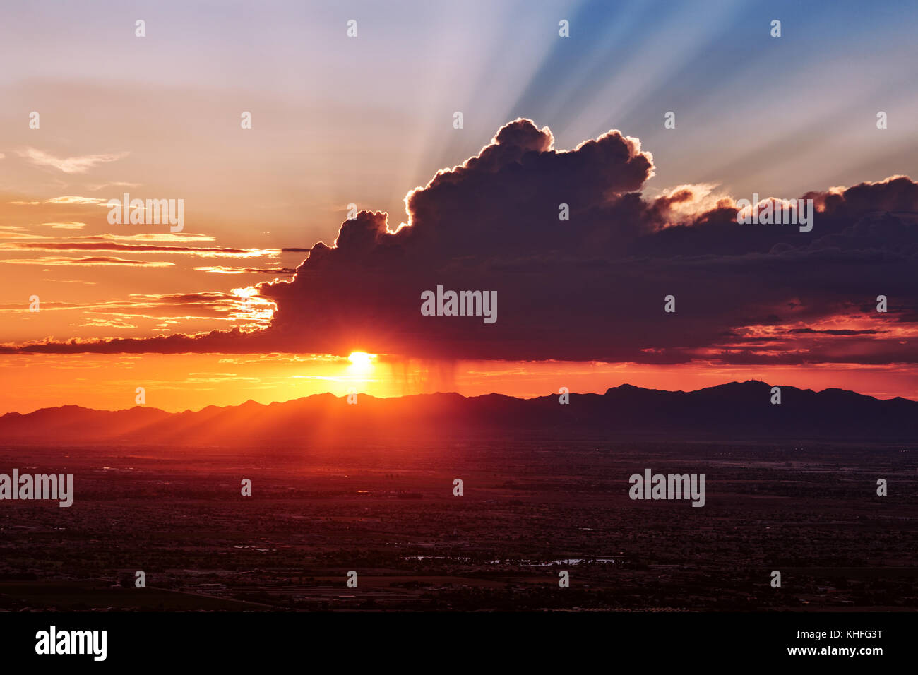 Dramatic crepuscular rays at sunset over the desert near Phoenix, Arizona Stock Photo