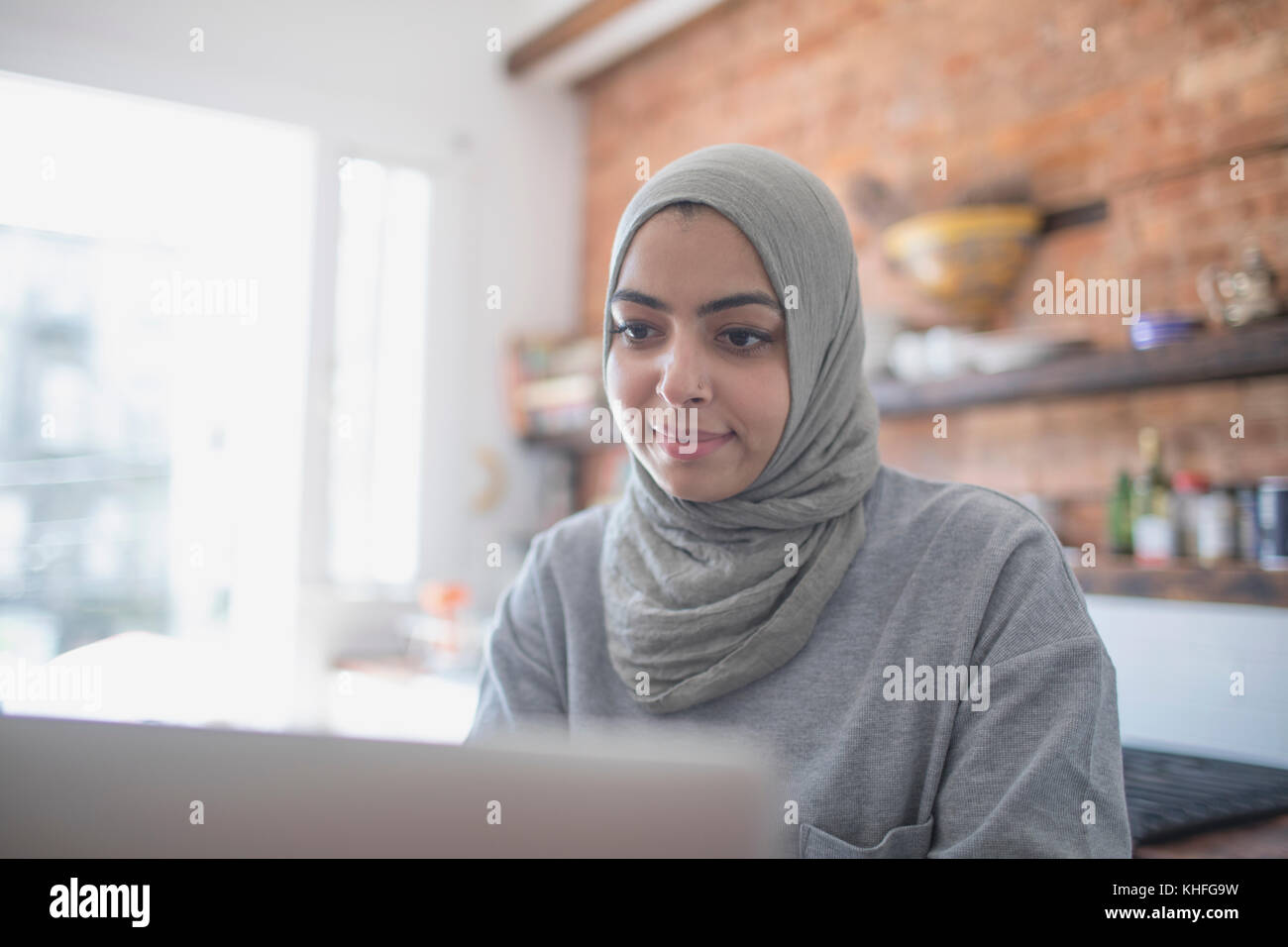Muslim businesswoman working from home on her laptop Stock Photo Alamy