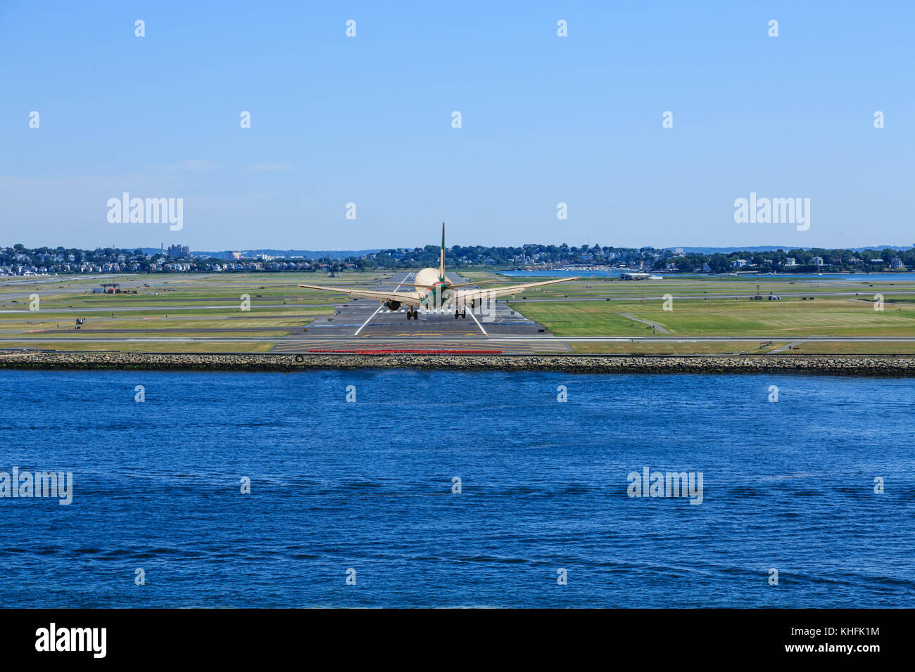 Plane Landing at Logan Airport from Harbor Stock Photo Alamy
