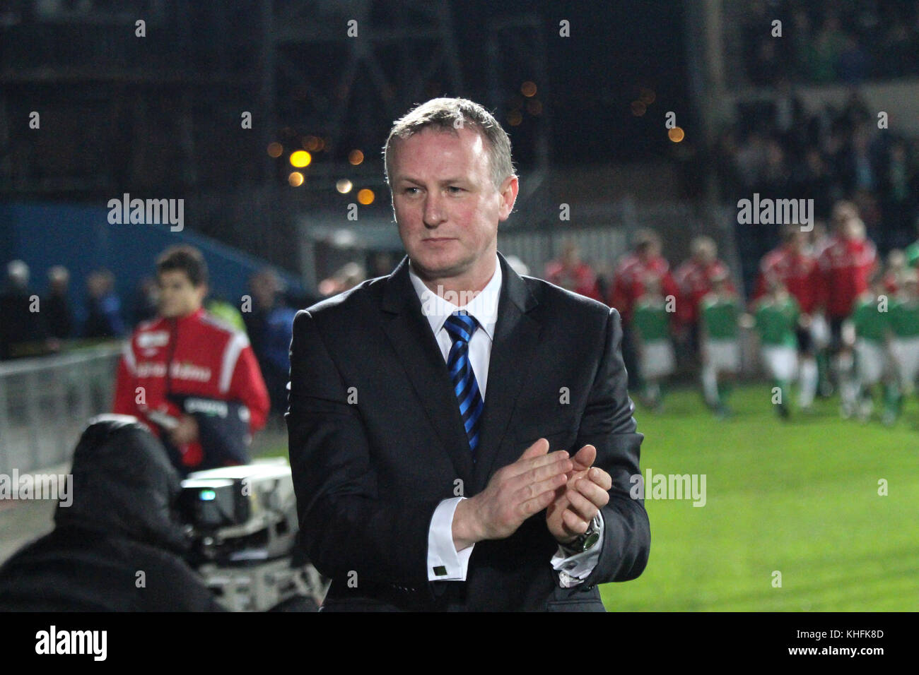 Michael O'Neill's first game in charge of Northern Ireland. O'Neill succeeded Nigel Worthington and his first game was at home to Norway on 29 February 2012 at Windsor Park Belfast. Here he applauds the home fans on his way to the dugout. Stock Photo