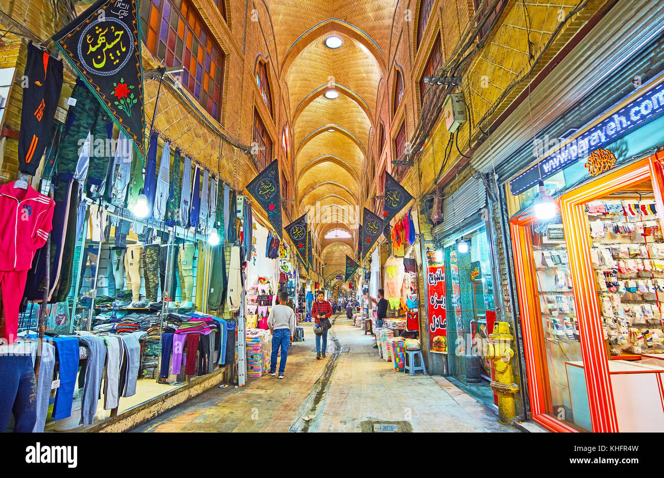 TEHRAN, IRAN - OCTOBER 11, 2017: The narrow archway in Grand Bazaar, traditional Eastern market, located in old town, on October 11 in Tehran. Stock Photo