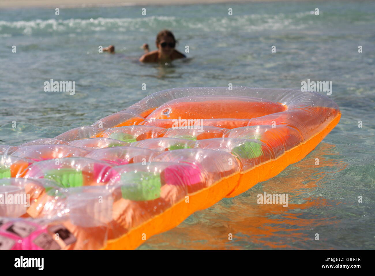 A lilo raft in the sea water as an essential holiday equpement Stock