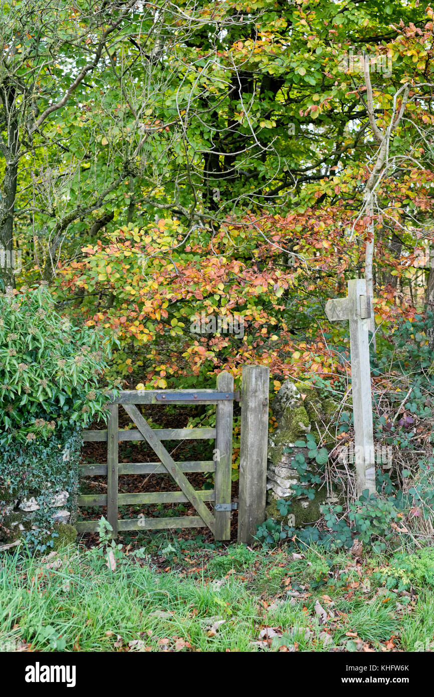 Cotswold way sign and wooden gate in autumn. Cotswolds, Gloucestershire, England Stock Photo