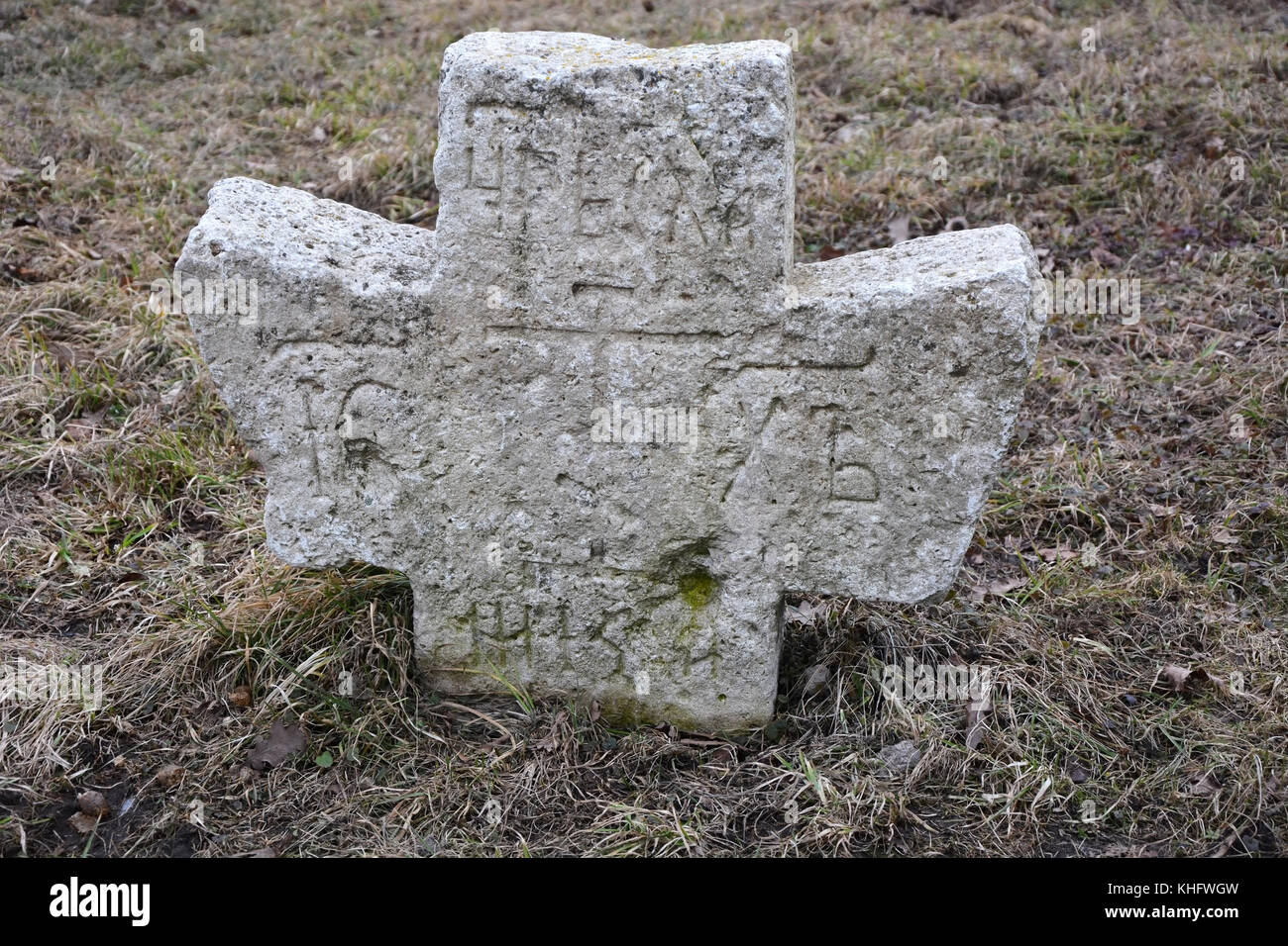 Ancient stone cross at the abandoned cemetery Stock Photo - Alamy