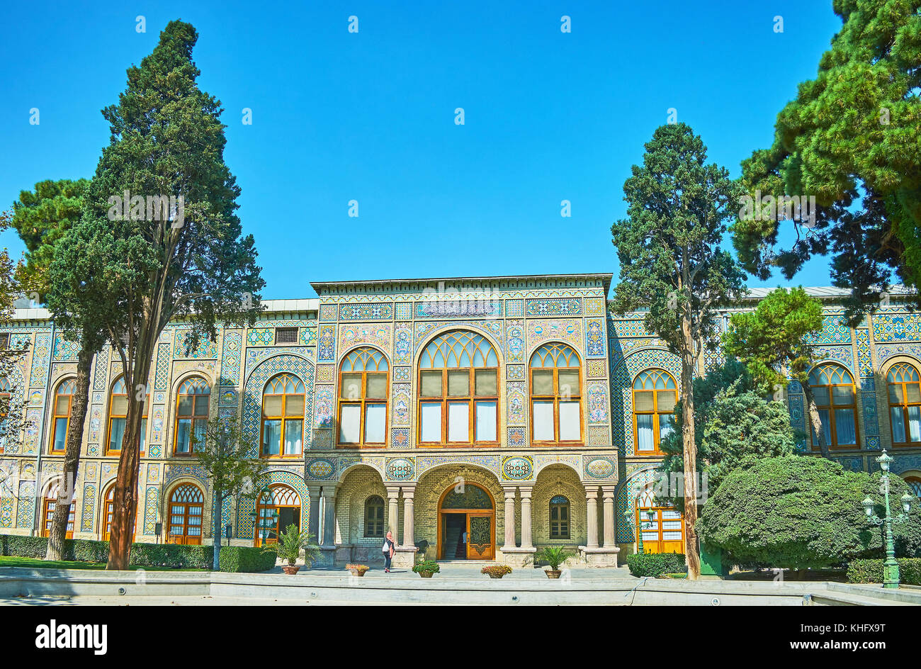 The facade of Golestan palace with scenic portico, decorated with stone columns, reliefs and tiled patterns, Tehran, Iran. Stock Photo