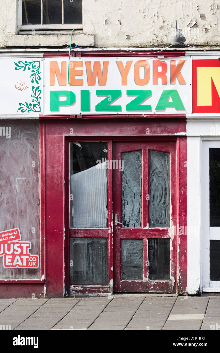 Closed Pizza take away on hight street. UK Stock Photo