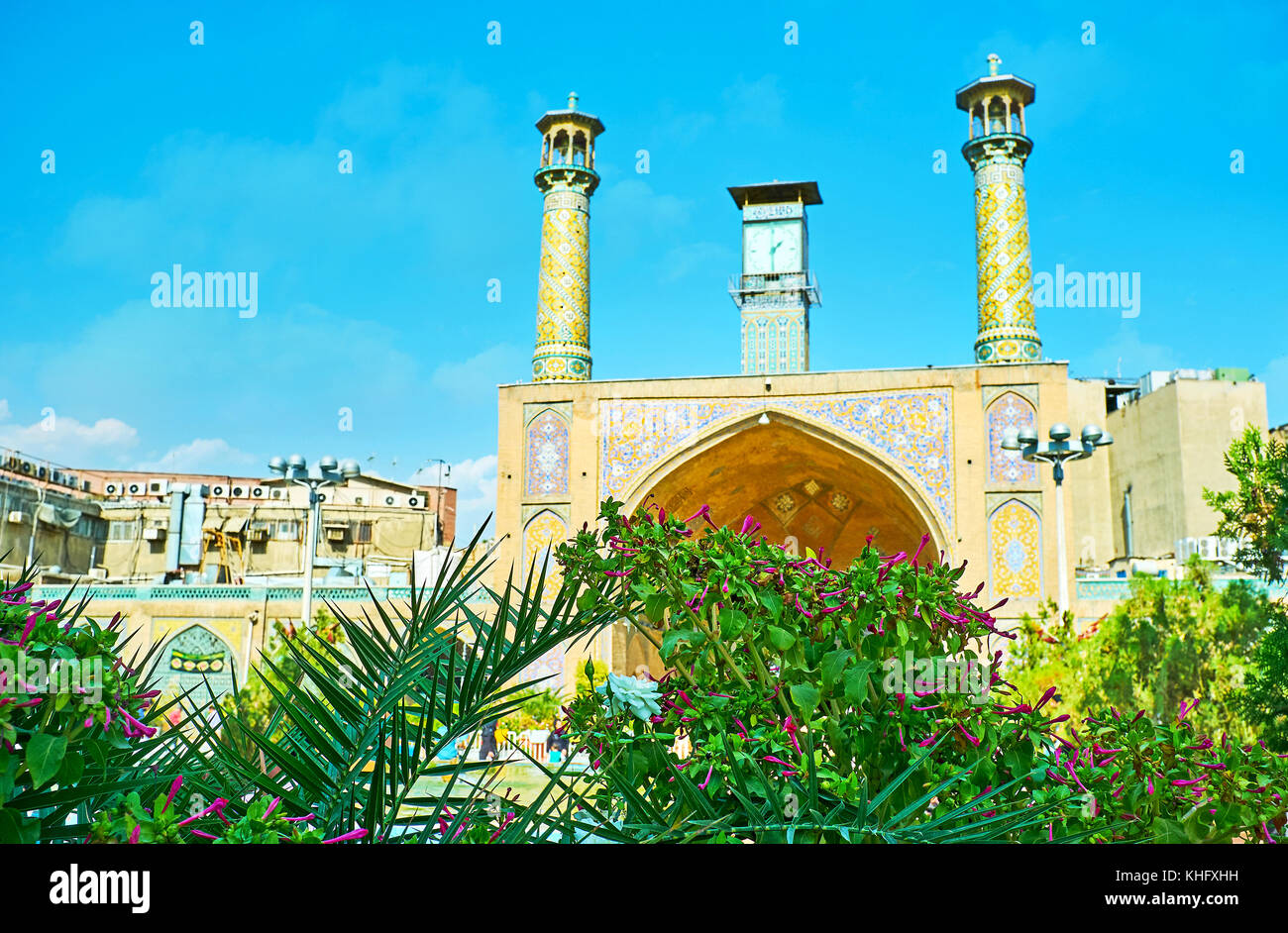 The medieval portal of Shah's Mosque with tiled patterns, minarets and ...
