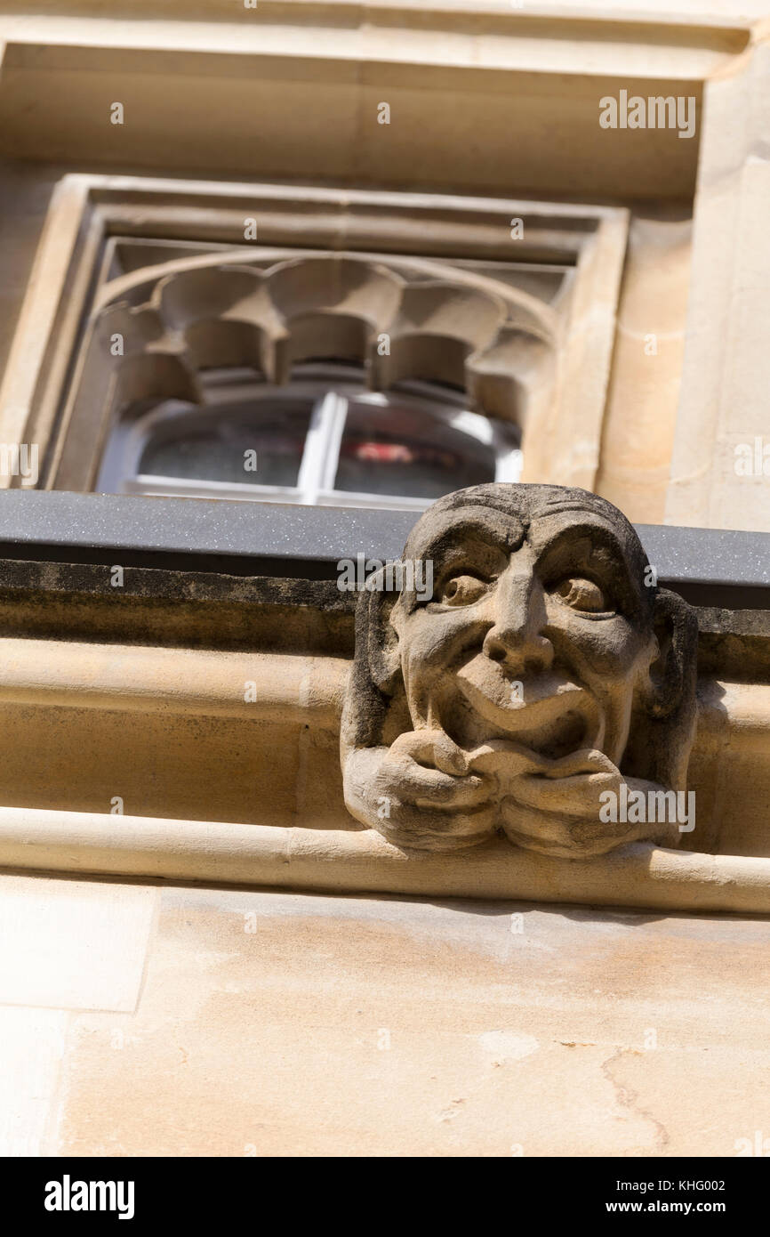 UK, Oxford, comical gargoyle sculpture on the side of Exeter College. Stock Photo