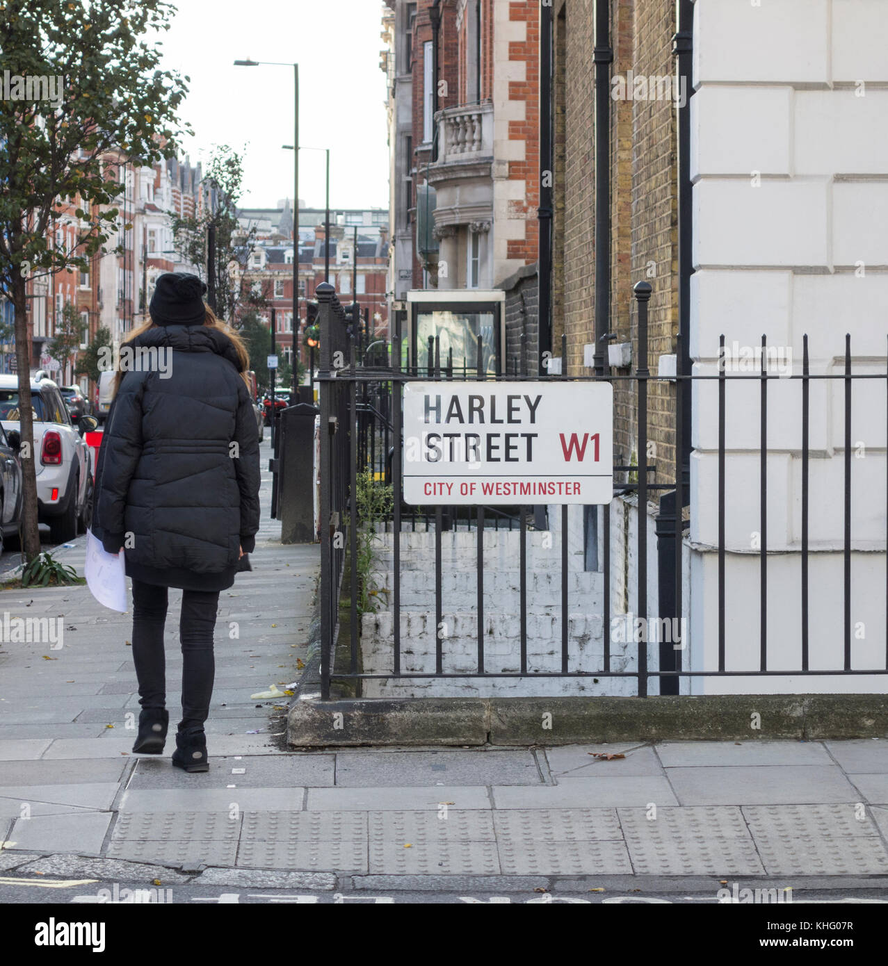 A woman on the corner of the famous Harley Street, City of Westminster, London, UK Stock Photo