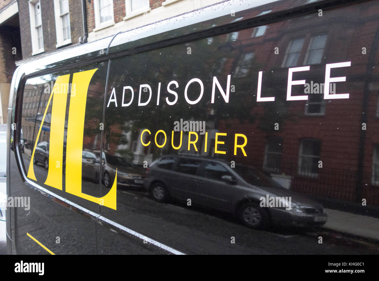 Addison Lee Courier transit van performing a pick-up in London Stock Photo