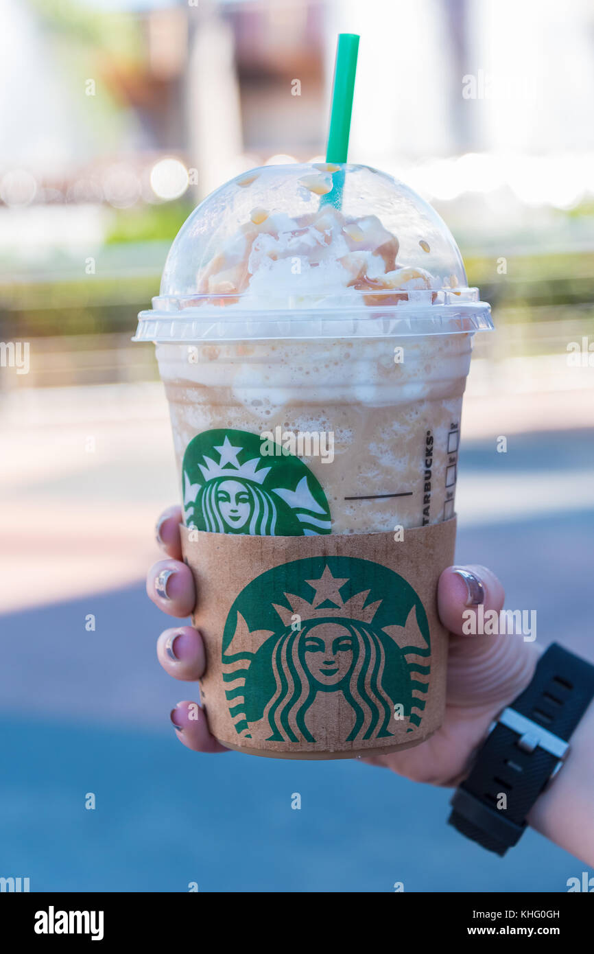 ORLANDO, USA - OCTOBER 31ST, 2017: Hand holding a Starbucks Frappuccino drink Stock Photo
