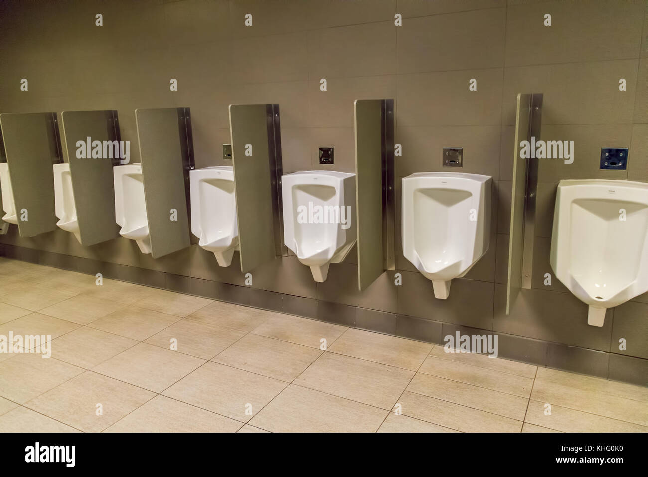 Row of mens urinals on a wall Stock Photo - Alamy