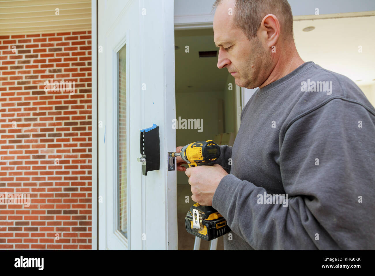Installation locked interior door woodworker hands install lock