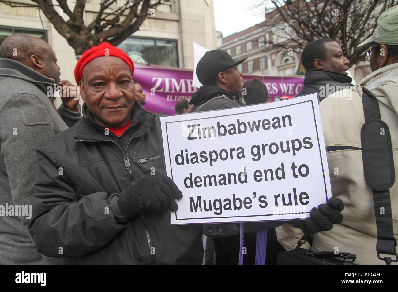 London, UK. 21 February 2015: Hundreds of Zimbabwean demonstrators take part in a demonstration outside Zimbabwe House in central London on Mugabe's 91st birthday on February 21st. Robert Gabriel Mugabe i has been President of Zimbabwe since 1987, and had previously led Zimbabwe as Prime Minister from 1980 to 1987.  Credit: David Mbiyu/Alamy Live News Stock Photo