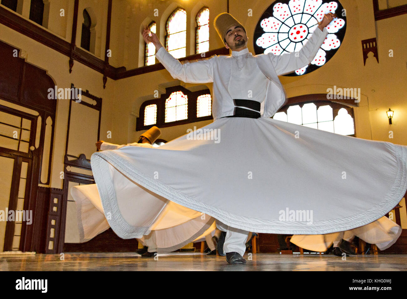 Whirling dervish during sufi whirling ritual known as Sema, in Istanbul, Turkey Stock Photo