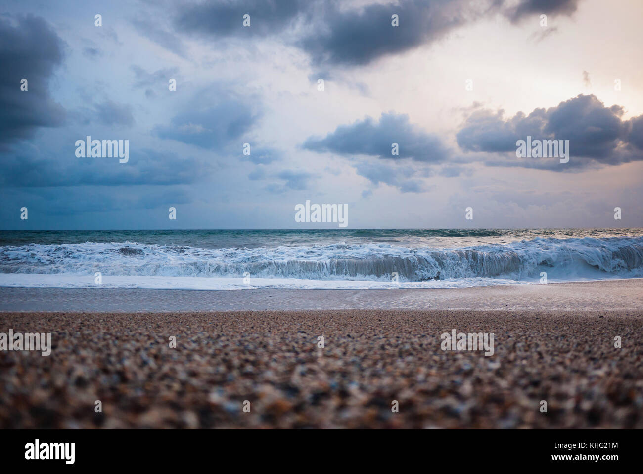 beach with waves after storm and clouds in the sky Stock Photo - Alamy