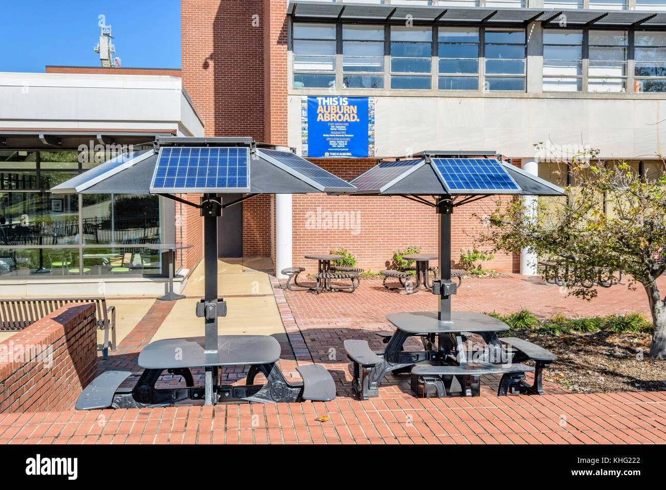 Solar powered computer and cell phone charging stations built into picnic tables at Auburn University, Auburn Alabama USA. Stock Photo