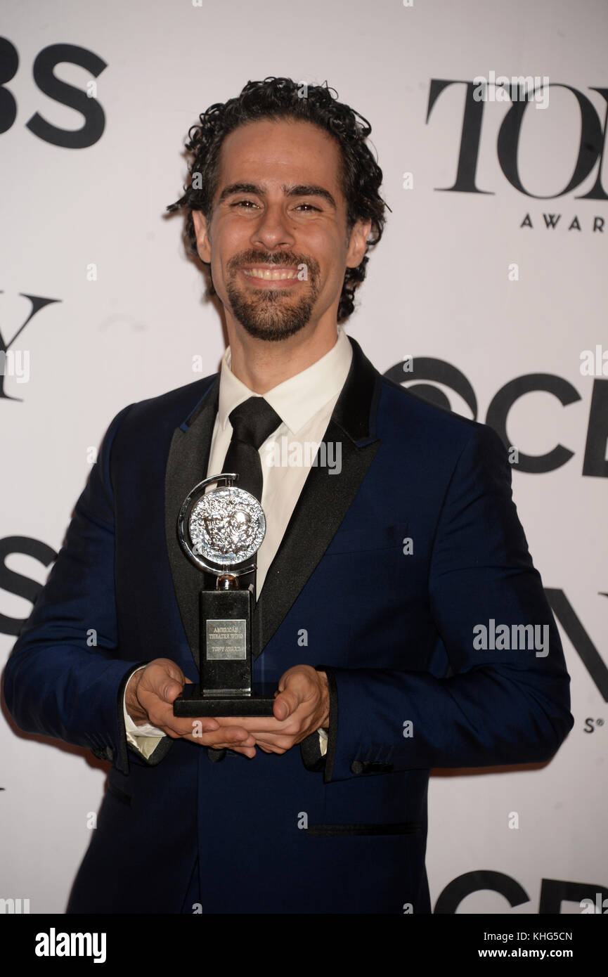 Alex Lacamoire poses in the press room with the award for best