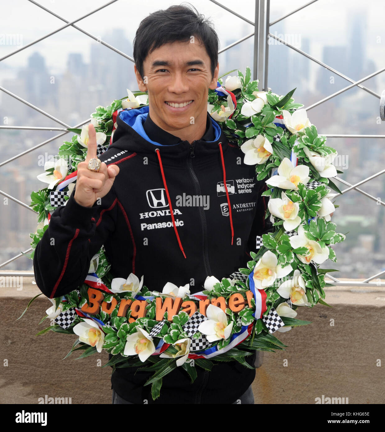 NEW YORK, NY - MAY 30: Indy driver Takuma Sato at The Empire State Building. Takuma Sato, winner of the 101st running of the Indianapolis 500 and driver of the #26 Ruoff Home Mortgage Honda, will visit the Empire State Building following his victory in Sunday’s historic race. Sato became the first Japanese driver to win “The Greatest Spectacle in Racing” when he edged three-time Indy 500 winner Helio Castroneves to the finish line by 0.2011 of a second. His victory marked the fifth overall and second consecutive Indy 500 win for Andretti Autosport on May 30, 2017 in New York City.    People:   Stock Photo