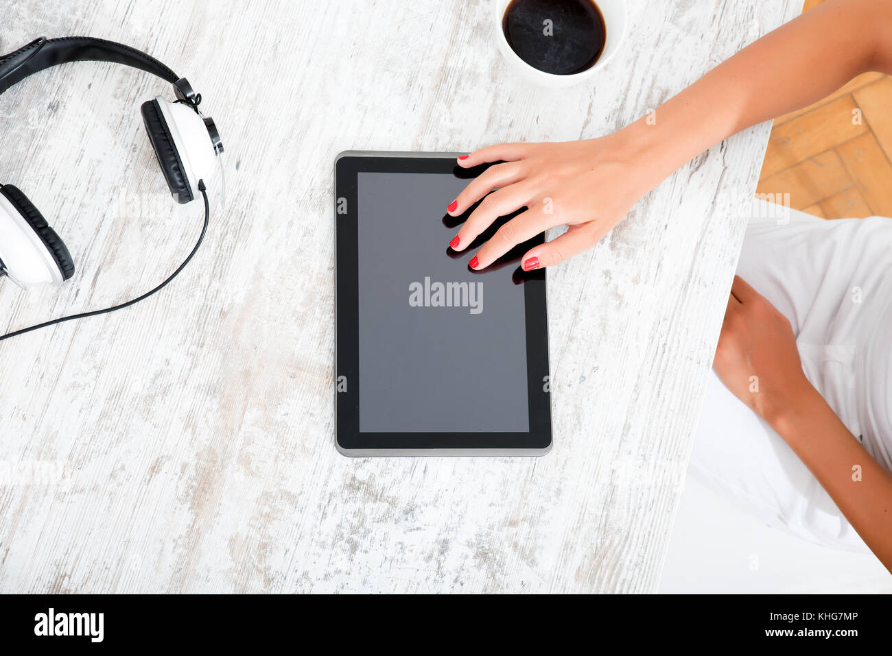 Beautiful young woman using a tablet pc at home Stock Photo - Alamy
