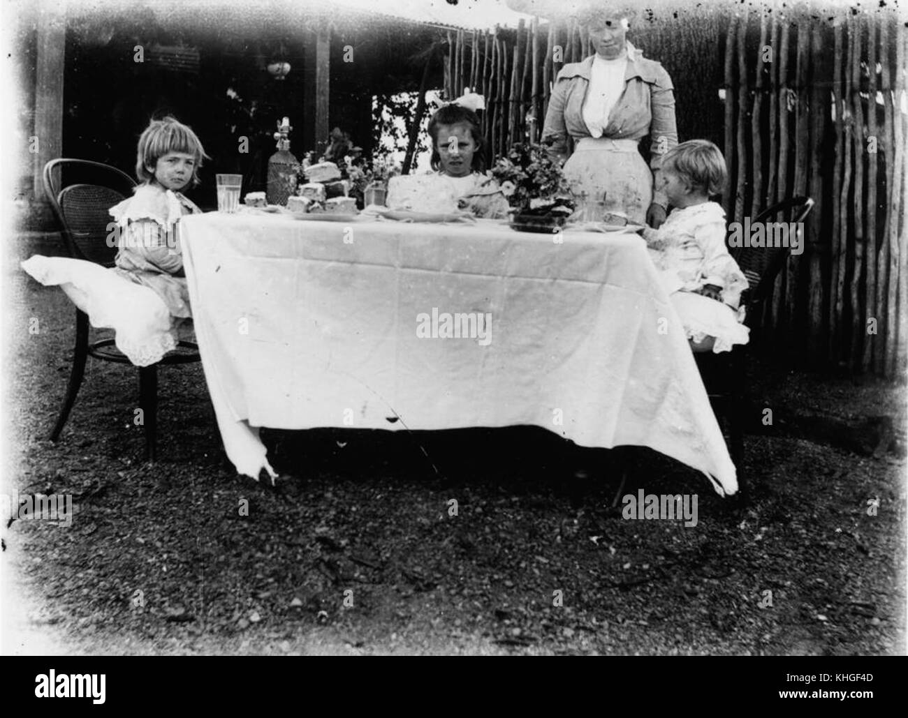1 167479 Children's afternoon tea party in a garden, Marlborough, 1900