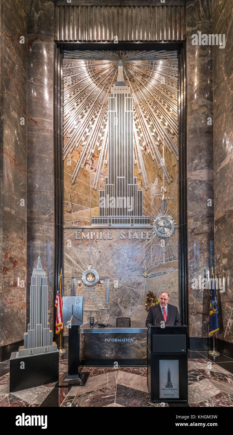 New York, USA. 16th Nov, 2017. Joseph 'Joe' Bellina, General Manager of the Empire State building, speaks in the lobby of the iconic New York landmark. Bellina was introducing the Radio City Music Hall Rocketttes to turn on the lights in red and green in celebration of the opening night of their Christmas Spectacular show. Credit: Enrique Shore/Alamy Live News Stock Photo