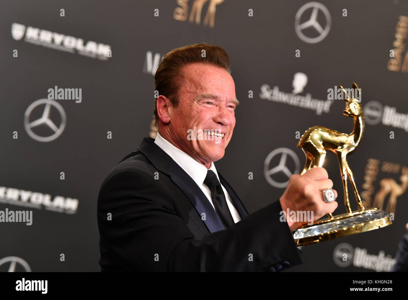 Actor Arnold Schwarzenegger Showing His Bambi, Which He Won In The "Our ...