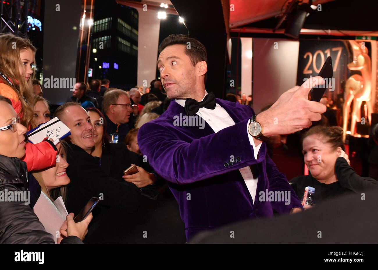 Berlin, Germany. 16th Nov, 2017. Australian actor Hugh Jackman taking pictures with fans during his arrival to the awards ceremony of the 69th edition of the Bambi media prize in Berlin, Germany, 16 November 2017. Credit: Jens Kalaene/dpa/Alamy Live News Stock Photo