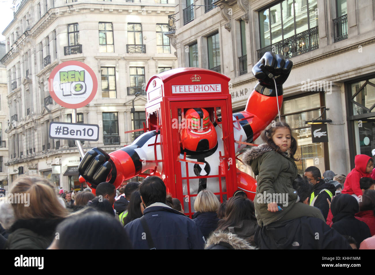 London, UK. 19th Nov 2017.  People with their children seen around a Ben 10 Hero installation during the Hamleys Christmas Toy Parade on a traffic-free Regents Street on 19 November. The mile of style was transformed into a traffic-free all-day extravaganza for the biggest Hamleys Toy Parade and ‘Character Meet and Greet'. Credit: David mbiyu/Alamy Live News Stock Photo