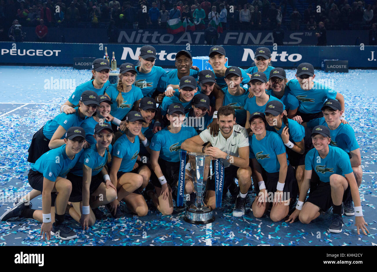 O2, London, UK. 19 November, 2017. Nitto ATP Finals, Grigor Dimitrov  celebrates his singles finals win over David Goffin on centre court. Ball  kids surround the winner for a photograph. Credit: Malcolm