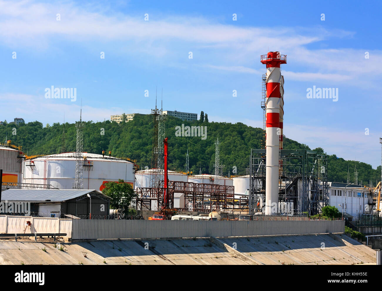 Tanks, pipes, tubes and working facilities of the large refinery Stock Photo