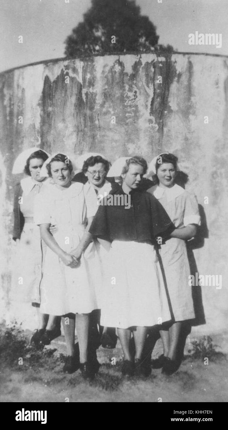 2 295571 Group of nurses against a water tank, Wondai, Queensland, 1949 Stock Photo