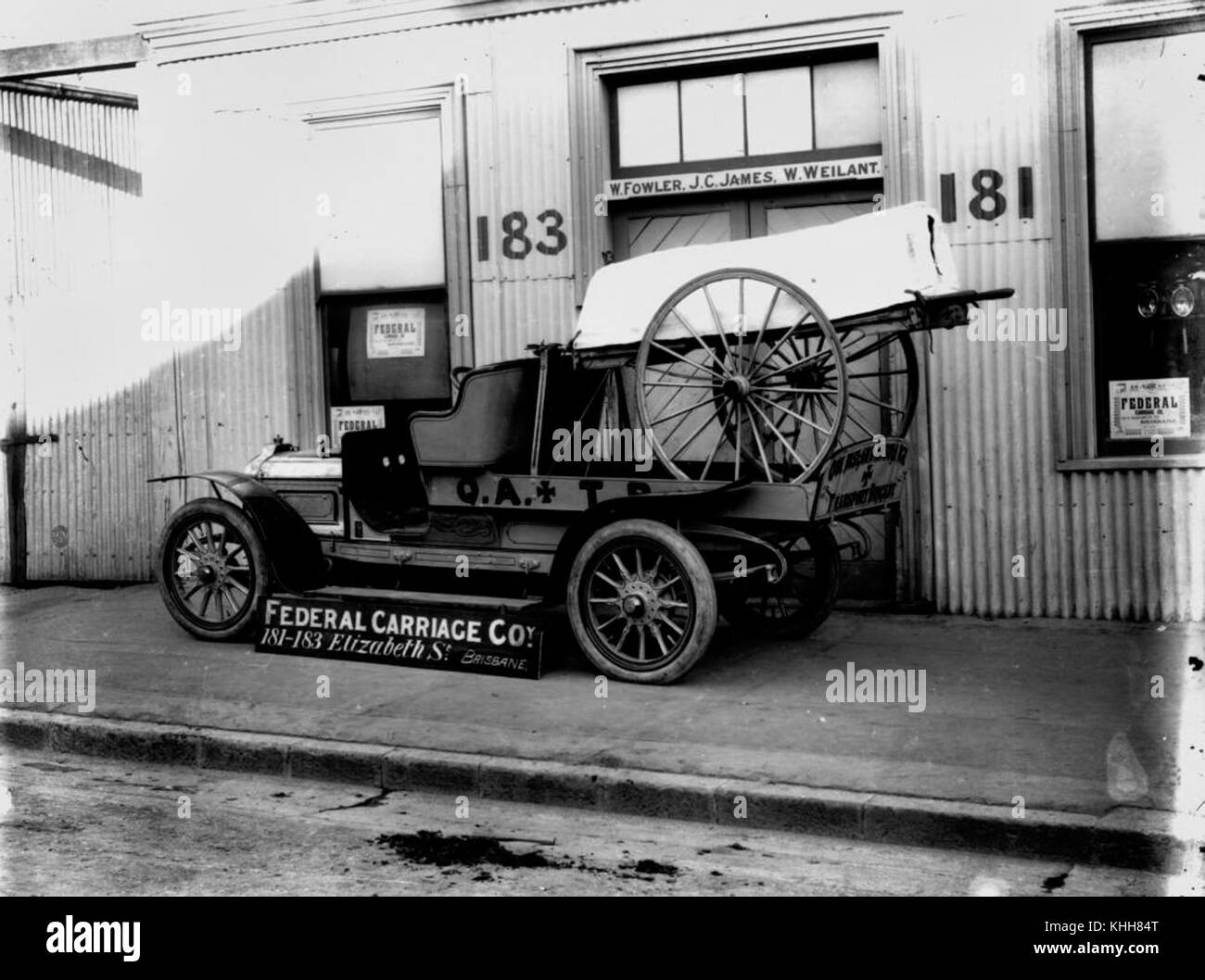 2 145691 Early motor ambulance and wheeled stretcher in front of the Federal Carriage Co. premises, Brisbane, 1912 Stock Photo
