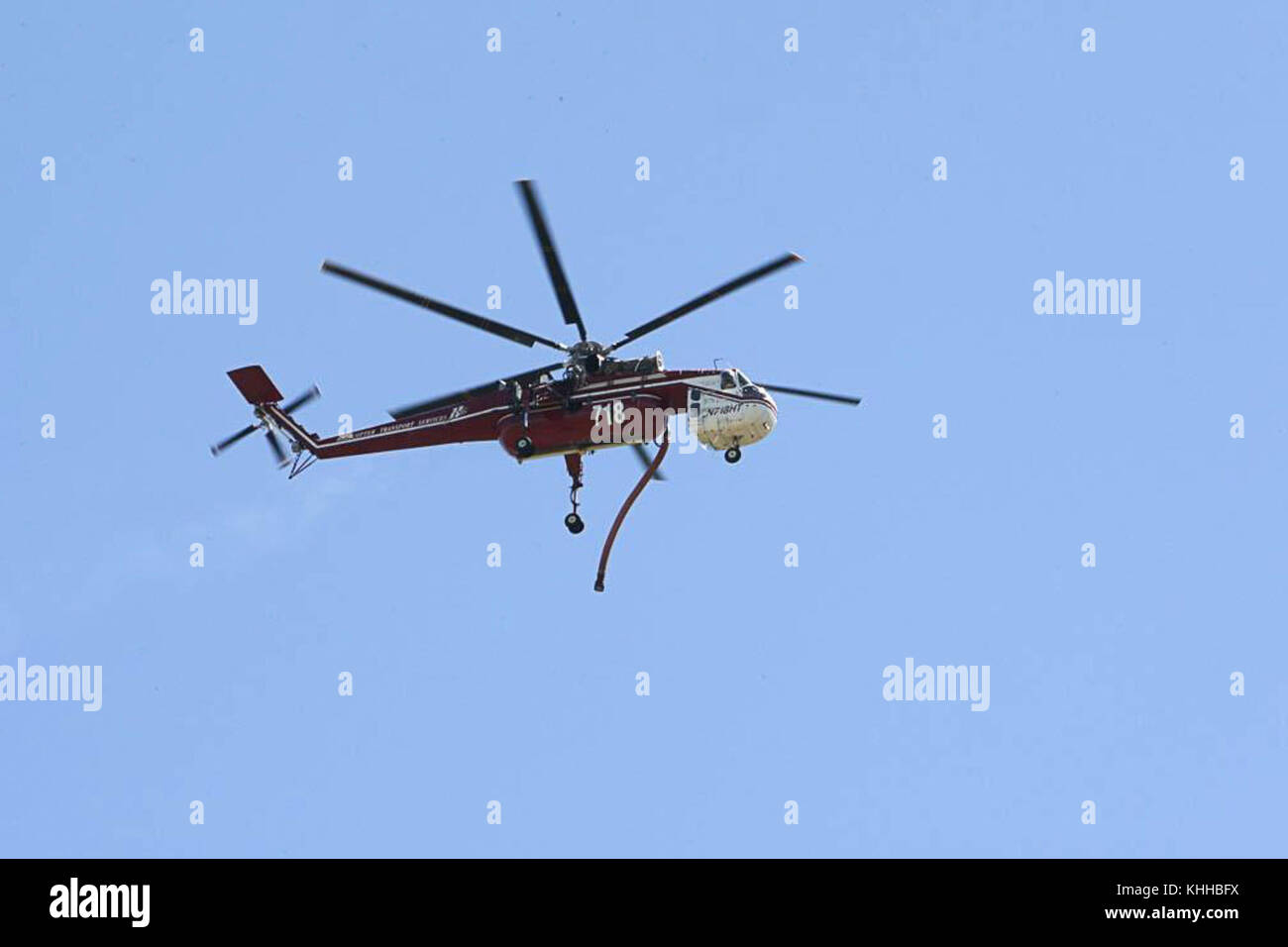 A helicopter prepares to make water drop on the Crow Peak Fire. The