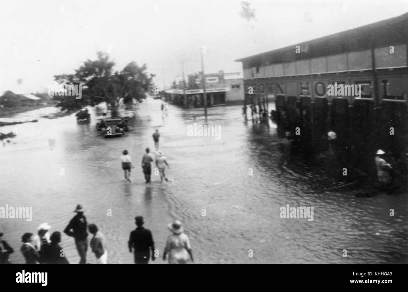 1 53844 Wading through flood waters near the Crown Hotel, Home Hill, 1940 Stock Photo